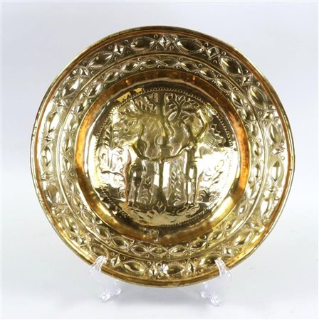 A Nuremberg baptismal dish depicting Adam and Eve at the tree of life....