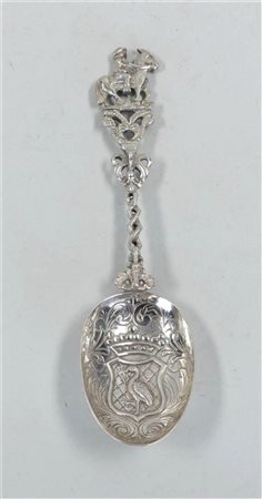 A silver commemorative spoon with the coat of arms of The Hague in the bowl....