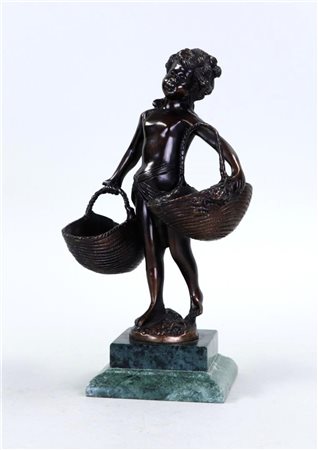 A bronze patinated sculpture of a girl with baskets, honed on a green marble...