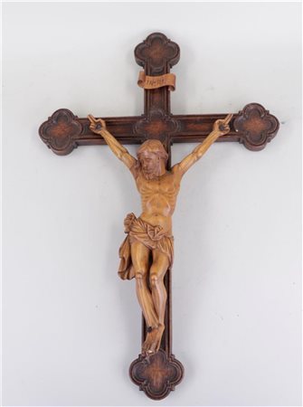 A wooden crucifix with a carved palm-wood Christ. ca. 1900. Height: 62 cm.