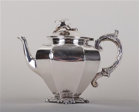 A silver teapot decorated with flowers on the lid, England, 19th century....