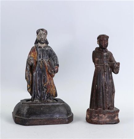 A lot consisting of two statues of saints, including a Franciscan monk and an...