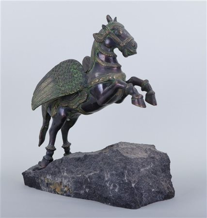 A bronze statue of a flying horse.30 x 35 cm.