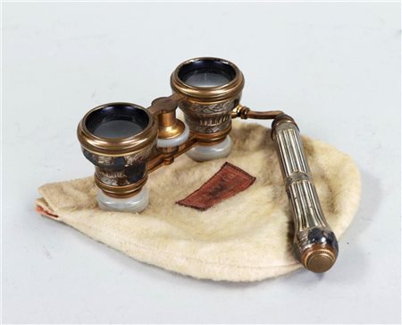 A pair of opera glasses in a cloth bag. ca. 1900/1920.