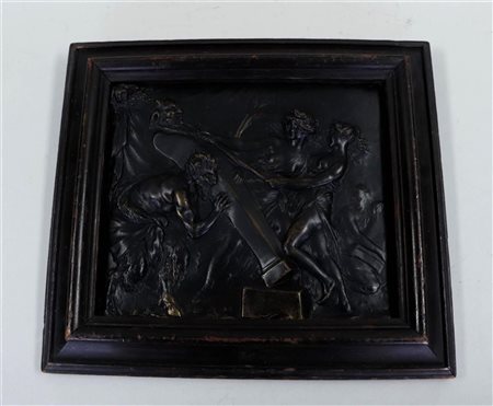 A bronze plaque of a group of nymphs and satyrs raising a bust. France, 19th...