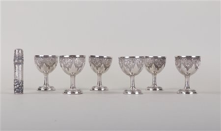 A set of six Djokja silver cups, with a needle case. 320 grams.