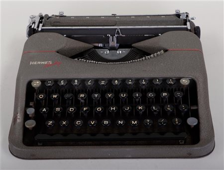 A Hermes Baby typewriter in a case.