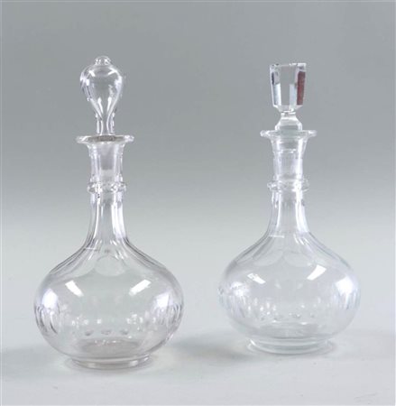 A lot of (2) glass carafes. One stopper added.