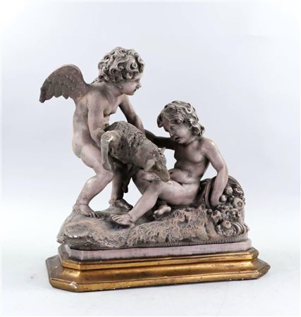 A plaster group with putti and goat. (damaged).