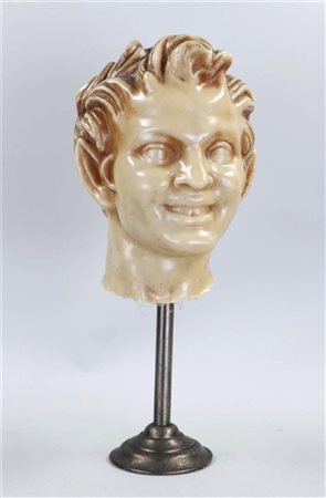 A wax head of a satyr, ca. 1900. Height: 47 cm. including stand.