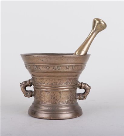 A bronze mortar and pestle, annotated all around. Height 12.5 x Diam. 14 cm.