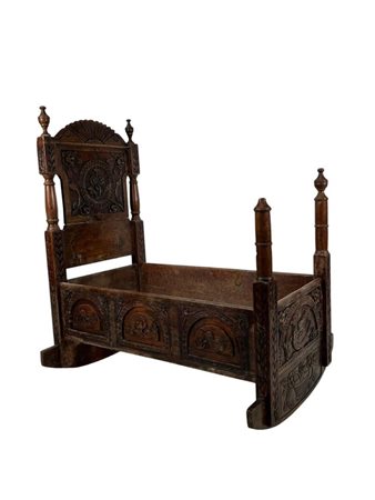 A Dutch, 18th century cradle with carving.103 x 95 x 53 cm.