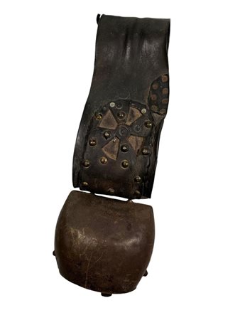 A large antique cowbell.L. 55 cm.