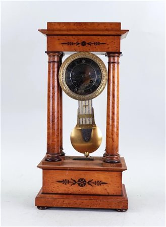 A walnut glued column clock, in moderate condition.