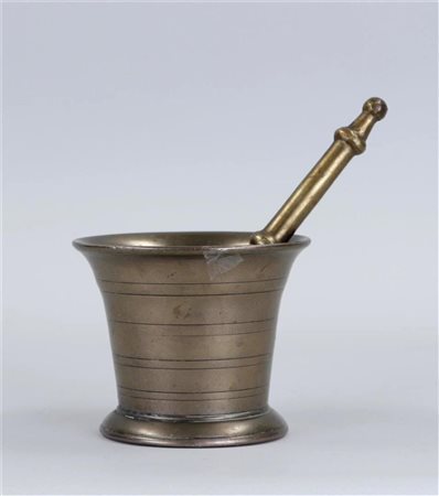 An antique bronze mortar and pestle.