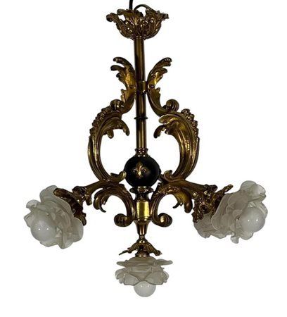 A solid brass chandelier with glass roses. France, late 19th century,50 x 55 cm.