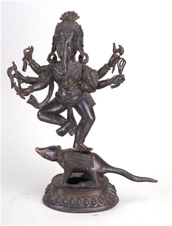 A bronze figure of Ganesha dancing on a rat. Tibet, 20th century.34 x 20 cm.