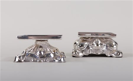 A pair of silver-plated standards in Louis XV style. The largest 10.5 x 10.5...