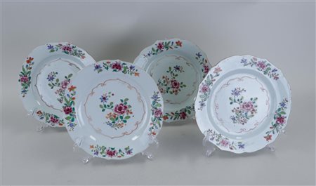 A set of four porcelain famille rose plates with floral decoration. China,...