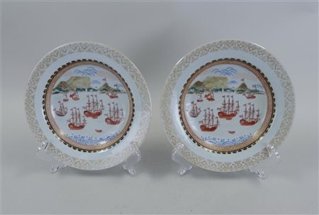 A set of porcelain plates decorated with V.O.C. ships and the table mountain...