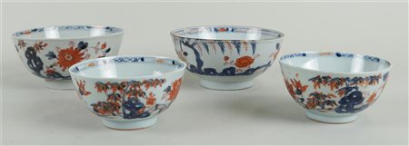 A lot of four porcelain Imari bowls. China, 18th century. Hairlines and...