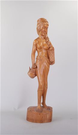 A Balinese statue of a young girl with a water jug.Hoogte 64 cm. en kleiner