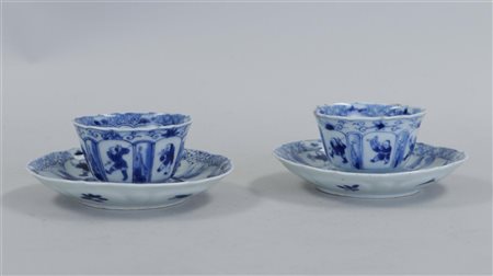 Two porcelain cups and saucers with amazon on horseback in the centre and...