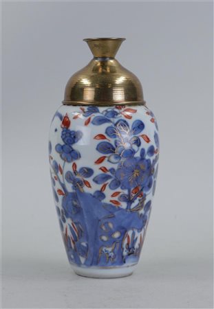 An Imari tea caddy with decoration of flowers and birds. Copper lid is glued...