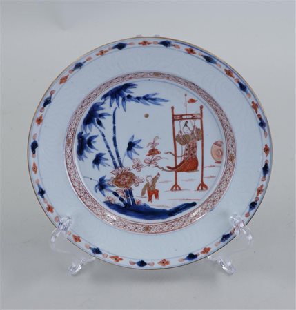 A Milk and Blood plate with decoration of a swinging lion near a fool in a...