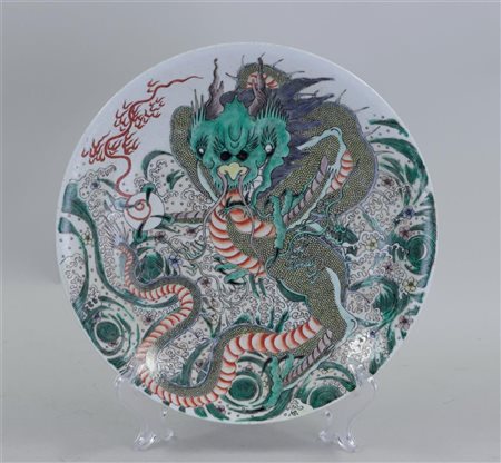 A porcelain famile verte dish with dragon decoration, marked Guanxu. China,...