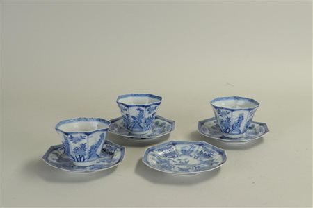 A lot consisting of 3 cups and four matching saucers, marked on the bottom,...