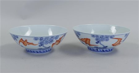 A set of porcelain iron red bowls decorated with bats, marked Guanxu. China,...