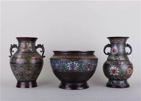 A lot consisting of (2) cloisonné vases and a cachepot, China 19th century....