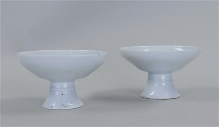 A set of two Blanc de Chine stem cups. China, 19th century. Minimal edge...