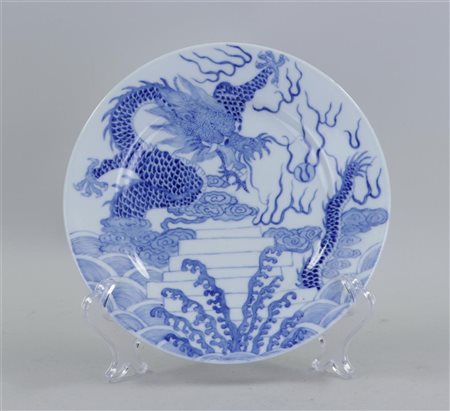 A porcelain plate with dragon decoration, marked Guanxu. China, 20th...