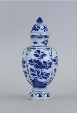 A porcelain covered vase with 4-panel decoration on the belly with floral...