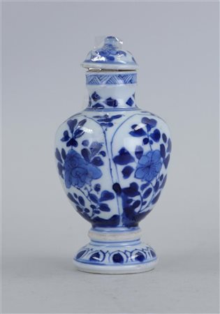 A porcelain covered vase with 4-panel decoration on the body with floral...