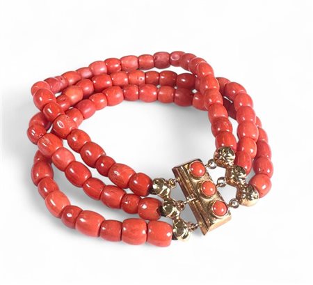 14kt yellow gold bracelet set with blood coral. The bracelet has a beautiful...