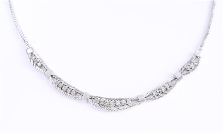 A white gold (14 kt) choker necklace set with 23 brilliant cut diamonds,...