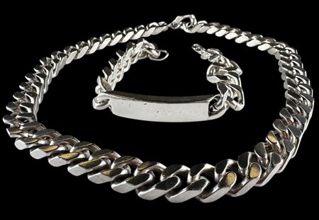 Jewelry set consisting of: A solid silver gourmet link plate bracelet and a...