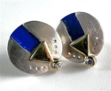 A pair of abstract, bicolor silver stud earrings set with lapis lazuli set...