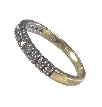 18kt Bicolor gold half alliance ring set with 14 brilliant cut diamonds of...