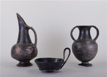 A collection of Etruscan pottery consisting of an amphora, a jug and a bowl...