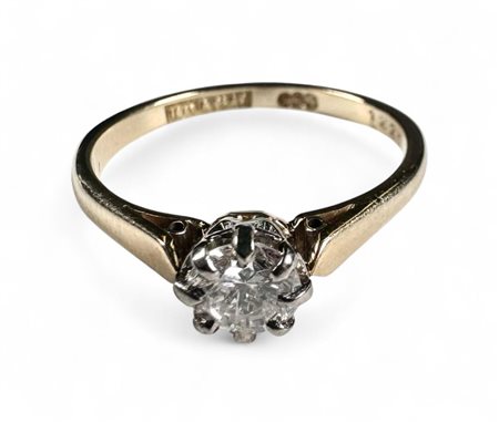 18kt Bicolor gold solitaire ring with platinum chaton setting and 1 brilliant...