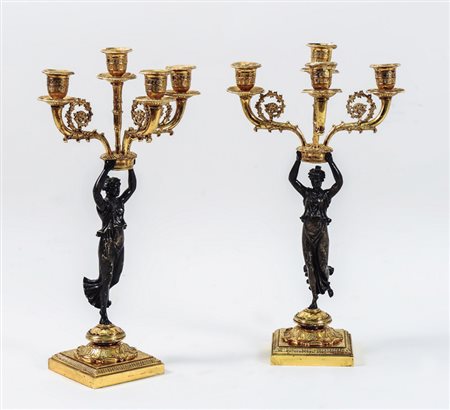 COPPIA DI CANDELABRI IN BRONZO DORATO E PATINATO - PAIR OF GILDED AND...