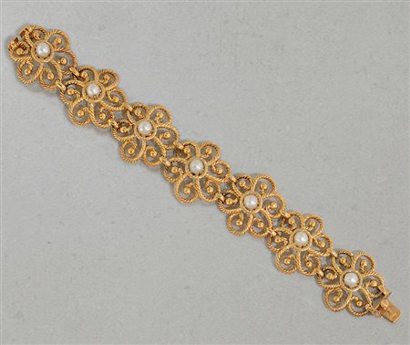 BRACCIALE BRACCIALE ANNI '50 CA. In oro giallo 18 kt a grandi fiori in...