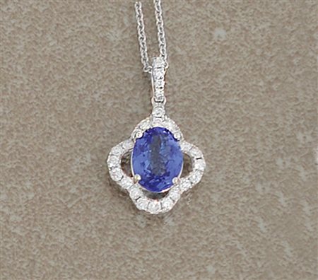 CIONDOLO CIONDOLO. In oro bianco 18 kt centrato da tanzanite taglio ovale di...