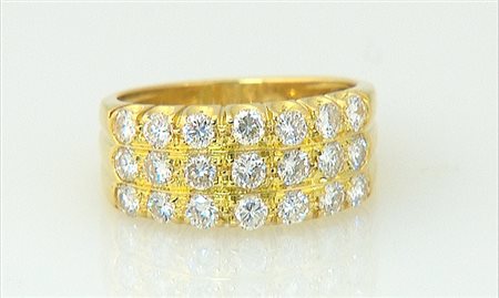 ANELLO ANELLO. In oro giallo 18 kt a fascia con tre file orizzontali in...