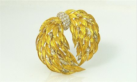 BRACCIALE SPILLA-CIONDOLO ANNI '50 CA. In oro giallo e bianco 18 kt...