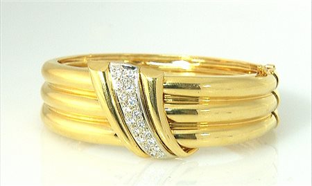 BRACCIALE BRACCIALE. In oro giallo e bianco 14 kt montatura rigida costolata...